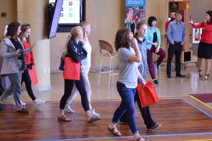 people walking across flooring