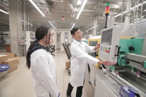 Tom Turng using a micro-injection molding machine