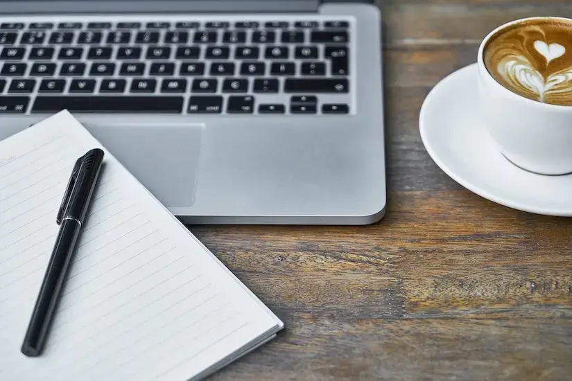 laptop and writing notebook