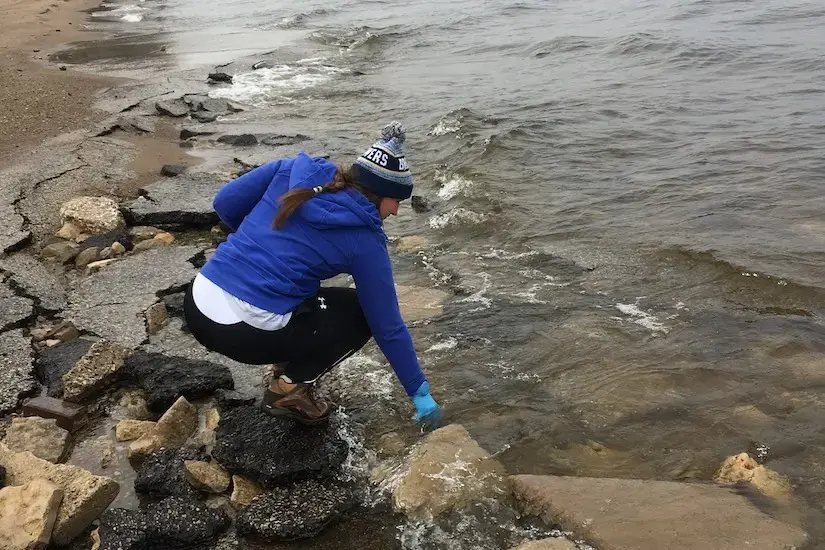 Bobbi Jo Helgemoe taking samples from a stream