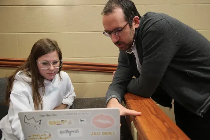 Justin Boutilier working with student