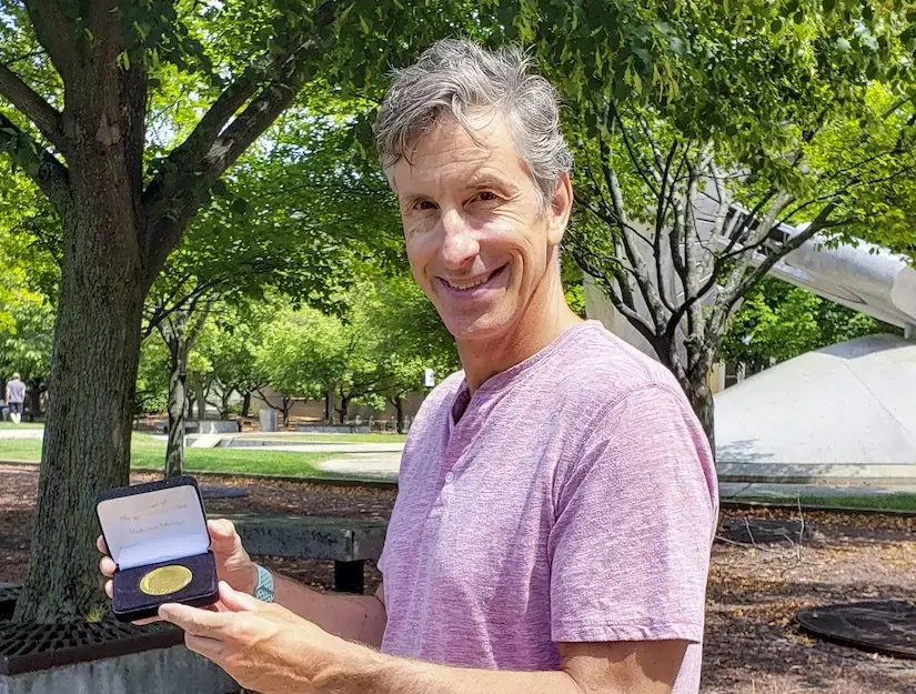 Robert Nowak holding award