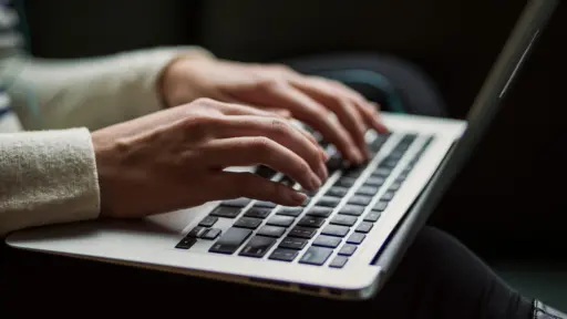 Close up typing on Laptop