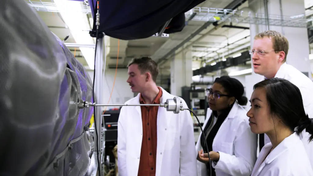 graduate students with their advisor in a nuclear research lab