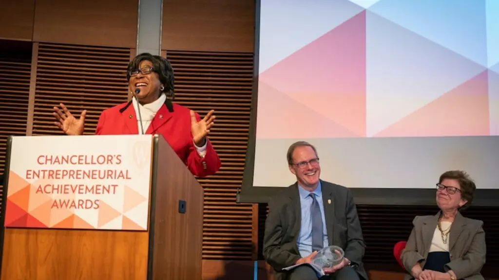 Valarie King-Bailey at podium for Chancellor’s Entrepreneurial Achievement Awards ceremony