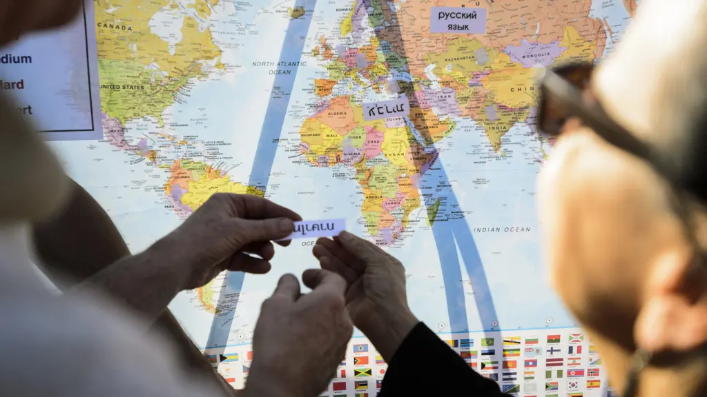 Two people matching writing with the country it is from on a map