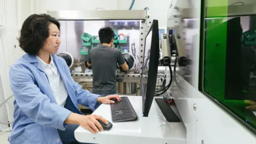 Bonita Goh and Yafei Wang working in the lab