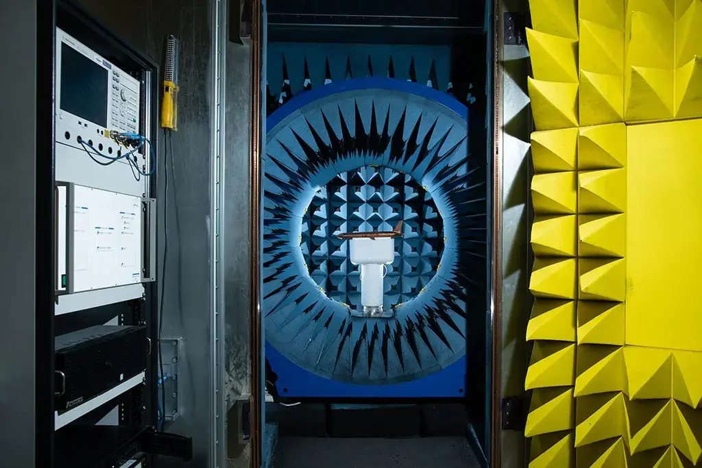anechoic chamber with brass airplane model inside