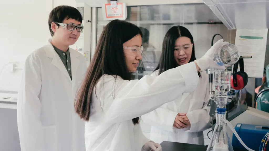 Mohan Qin and Haoran Wei work with Ziyan Wu (fore) as she pours water for testing