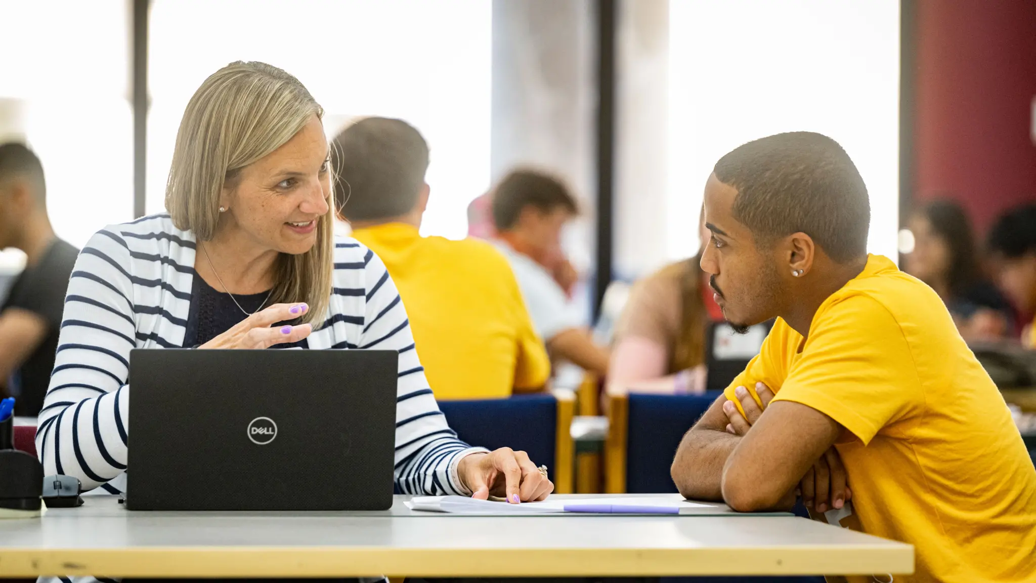 Incoming student chatting with advisor at STAR day.