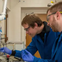 Marcel Schreier working in the lab with student Alex Zielinski