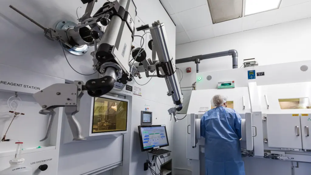 A technician works with radioisotopes