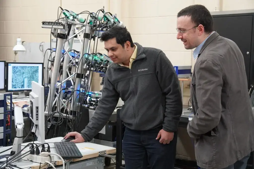 Eriten and student with vibrometer