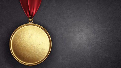 Blank gold medallion on red ribbon with gray background