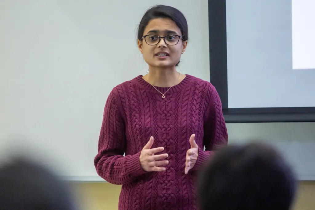 Maitreyee Marathe, UW–Madison PhD student in electrical and computer engineering, presents a flash talk about optimal energy rationing for prepaid electricity customers during the Wisconsin Energy Institute (WEI) Research Showcase at the WEI building on the the University of Wisconsin–Madison campus on Feb. 17, 2023. (Photo by Matthew Wisniewski / Wisconsin Energy Institute)