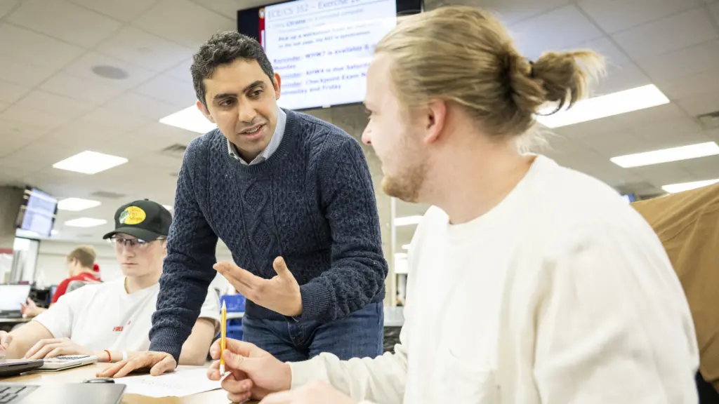Kassem Fawaz talks to a student at UW-Madison