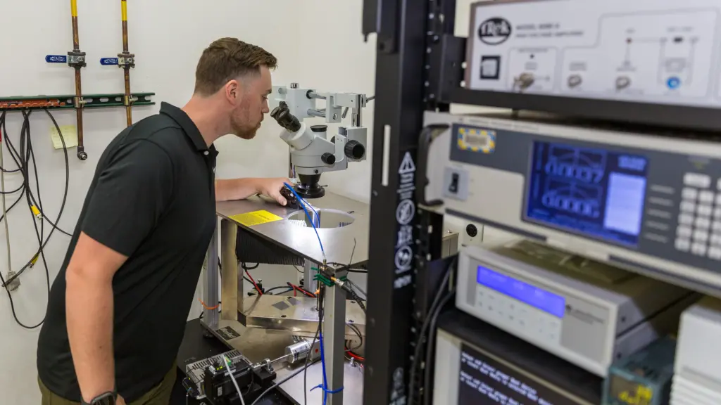 PhD student Michael Patton working in lab