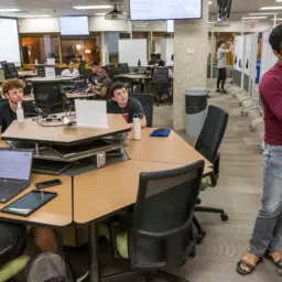 Bhumesh Kumar, right, a PhD student in electrical and computer engineering, guides students through a problem during a session of ECE 532: Matrix Methods in Machine Learning.