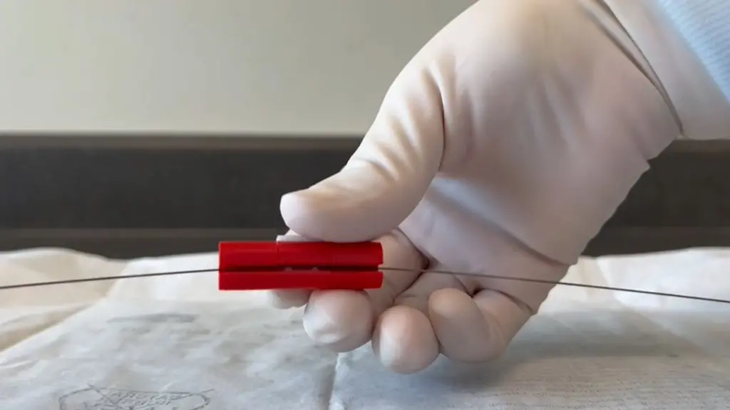 NECTO device attached to a surgical guidewire