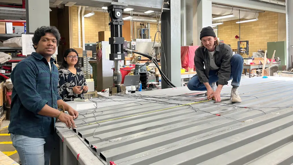 CEE students Gowshikan Arulananthan, Monamy Mustaq and Nate Opperman set up a fiber optic monitoring system
