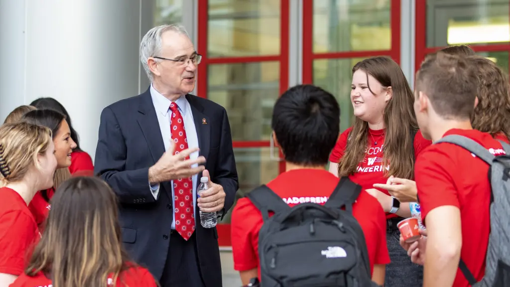 Ian Robertson talking with students