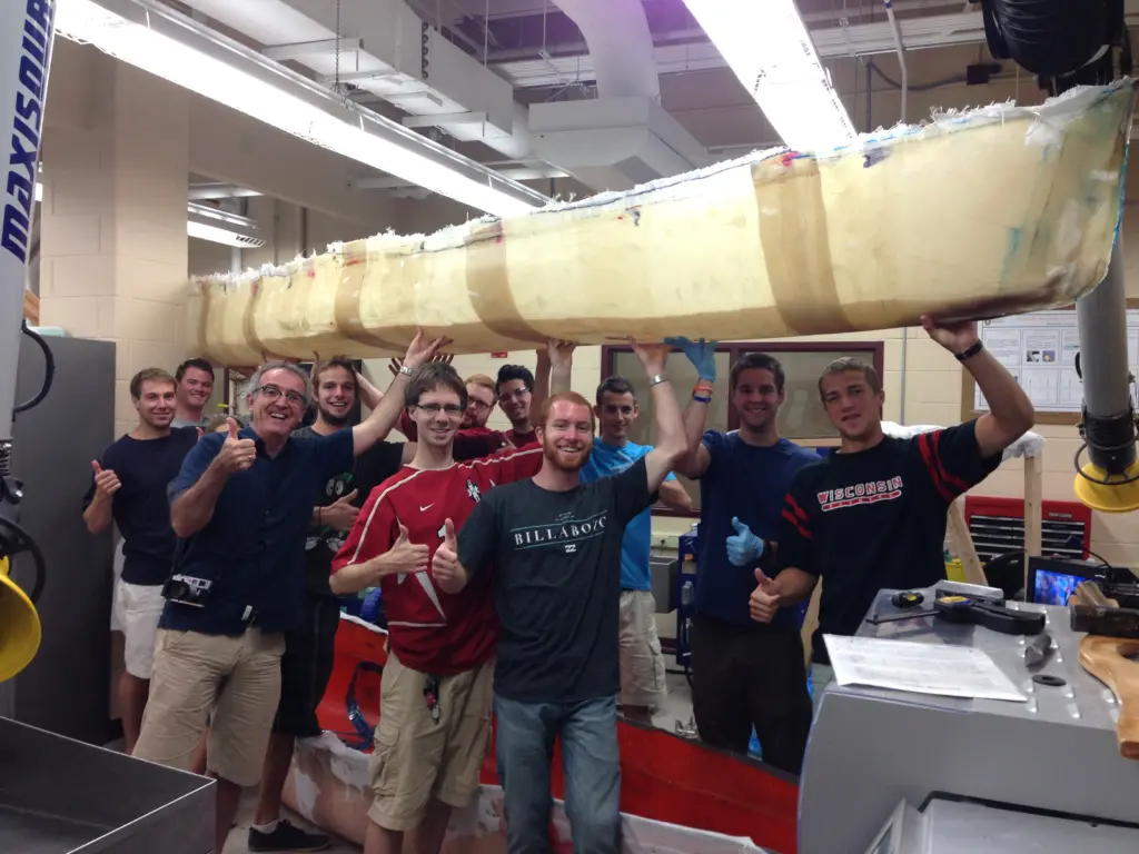 Osswald and students holding canoe 2014