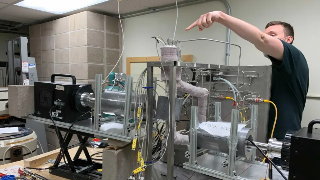 Cody Falconer works on the molten salt loop in the laboratory