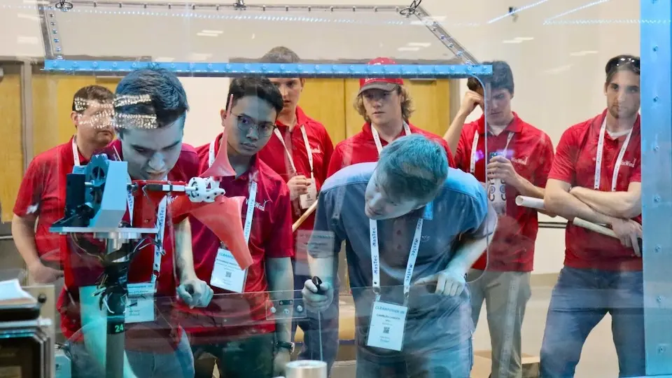 WiscWind team members demonstrate their wind turbine during 2024 Collegiate Wind Competition