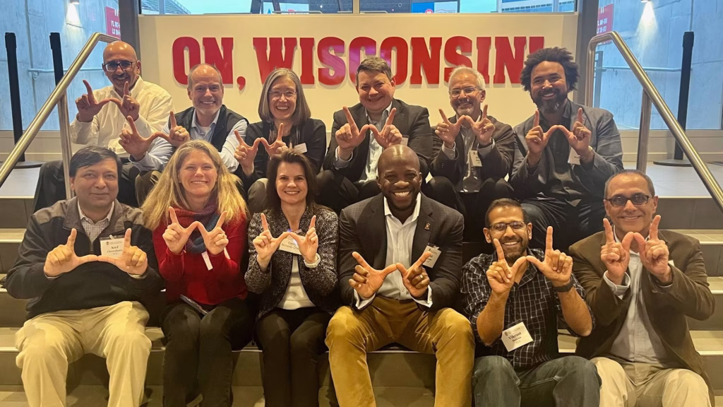 ECE Advisory Board sitting on steps inside Camp Randall Stadium