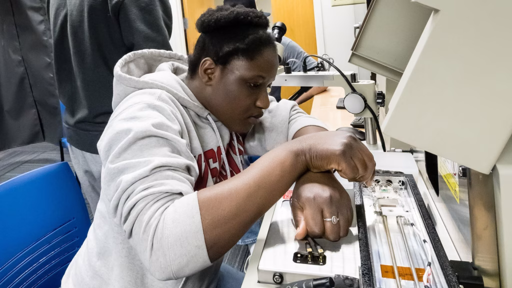 ECE Student working on equipment in ECE Semiconductor Instructional Lab