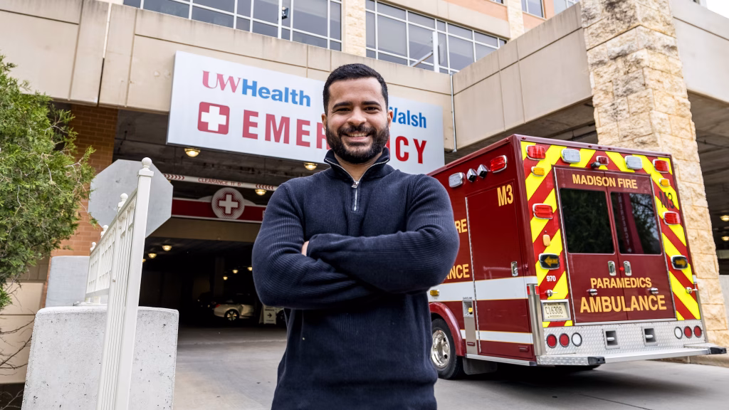 PhD student Fernando Acosta-Pérez stands in front of the emergency entrance at UW Hospital