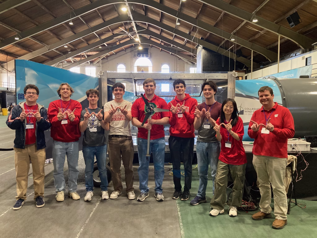WiscWind student org with the wind turbine they constructed