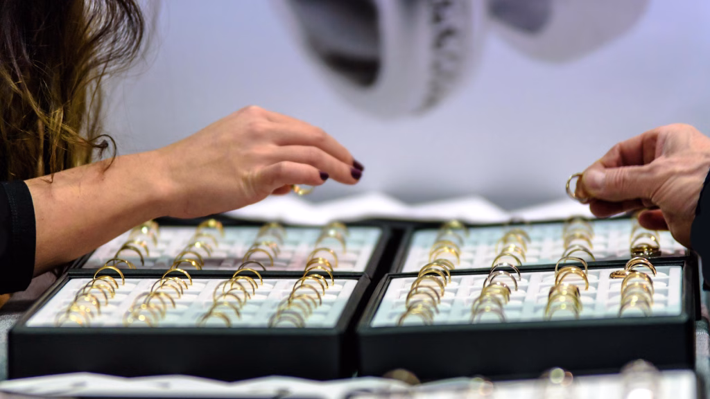 Customer inspects rings at jewelry store