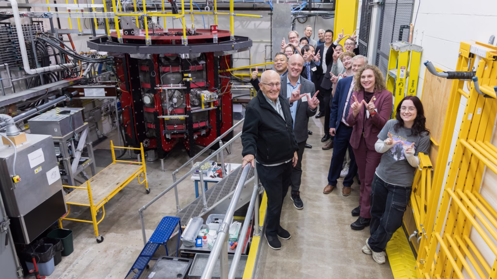 Stephanie Diem, nuclear engineering and engineering physics assistant professor, gives forum attendees a tour of her Pegasus-III fusion energy lab—part of the clean energy interest area.