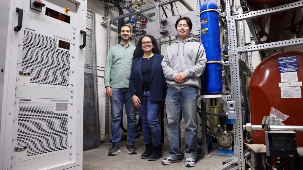 Associate Professor Juliana Pacheco Duarte poses in the new PHILUS facility alongside PhD student Cole Dunbar and Dr. Donkoan Hwang.