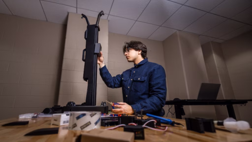Max Schneider, Co-President of Wisco Humanoids, working on an armature for humanoid robot.